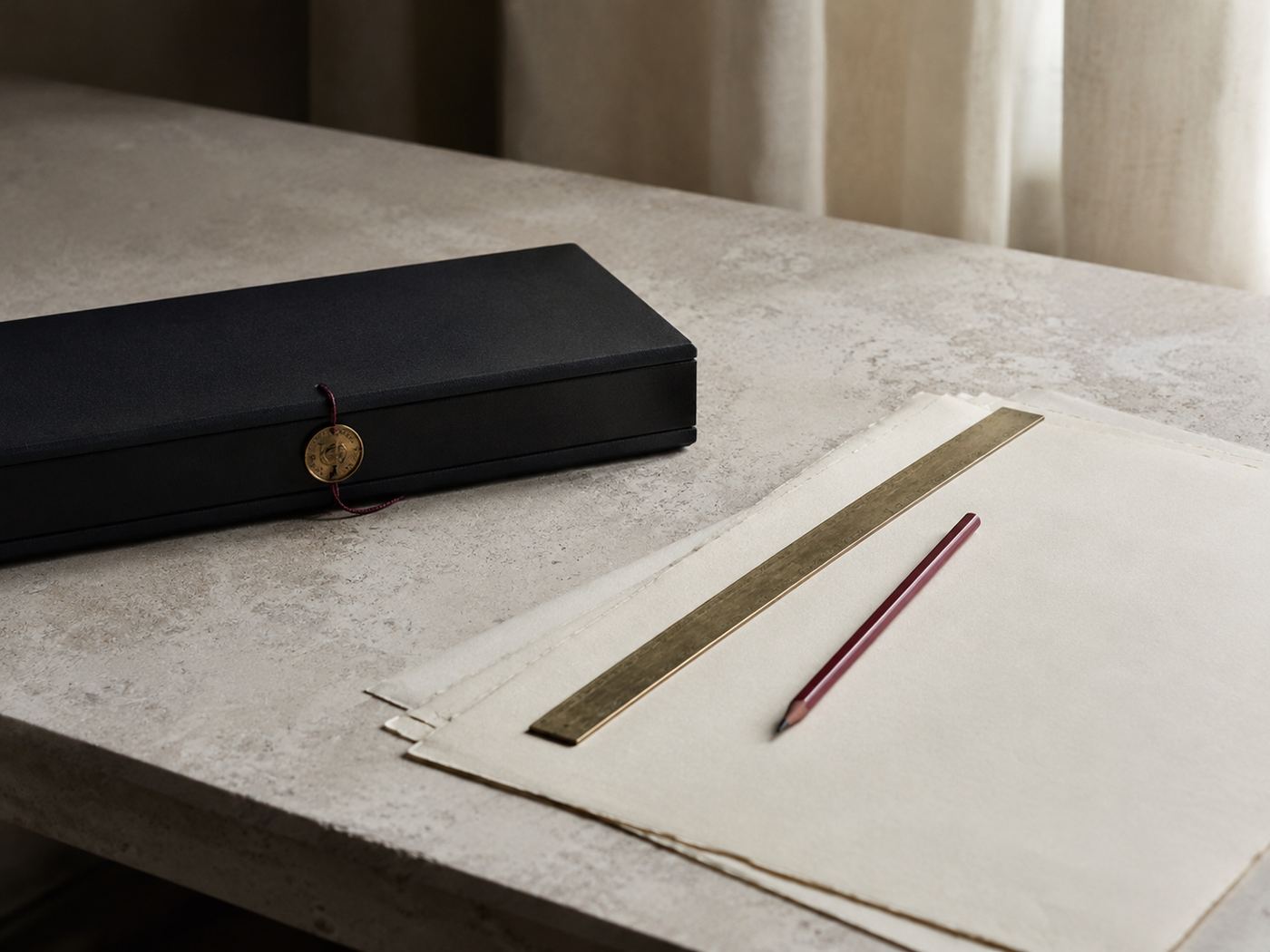حافظة وثائق ومسطرة نحاسية وقلم على رقّ — a document case, brass rule and pencil on vellum